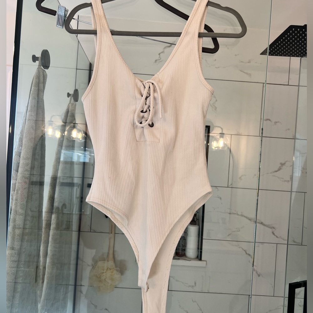 White bodysuit with string tie upfront